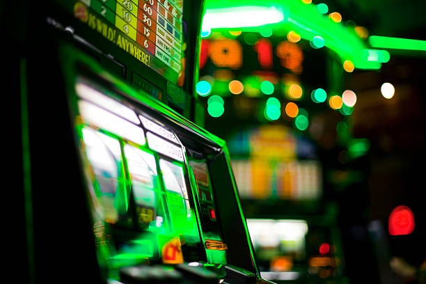 Live dealer presenting Free Bet Blackjack table with card shoe and betting area